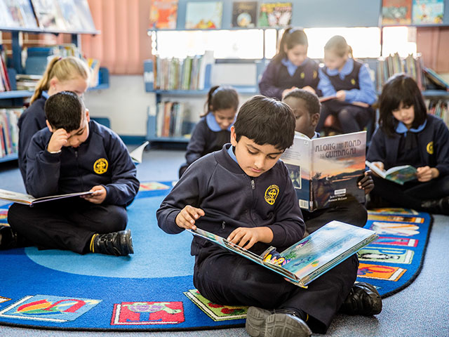 Students reading in the St Michael's Primary Blacktown school library