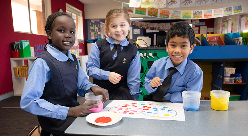 St Michael's Primary School Blacktown South students painting in class