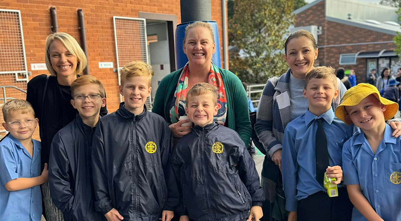 Students with their mothers at a Mothers Day event at St Michael's Primary School Blacktown South