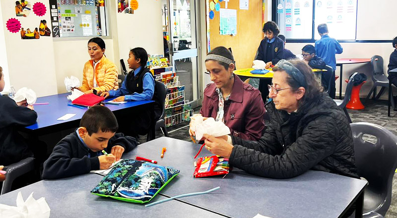 Parents in their childrens classroom at St Michael's Primary School Blacktown South