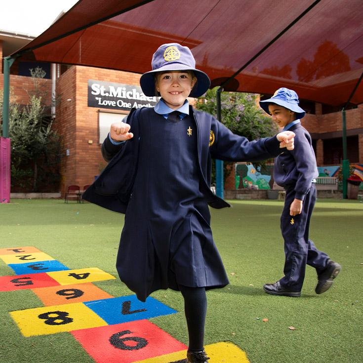 Student playing hop scotch in the playground at St Michael's Primary School Blacktown South