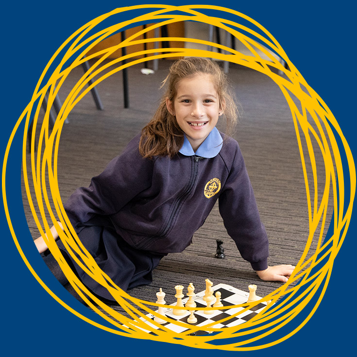 Student playing chess at St Michael's Primary School Blacktown South