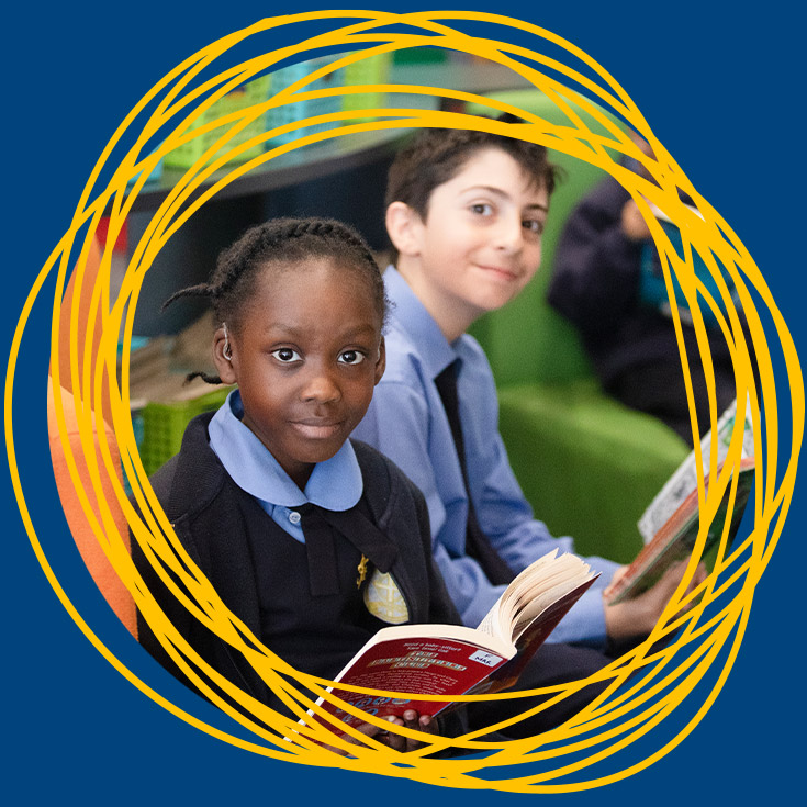 Students reading books together at the school library at St Michael's Primary School Blacktown South