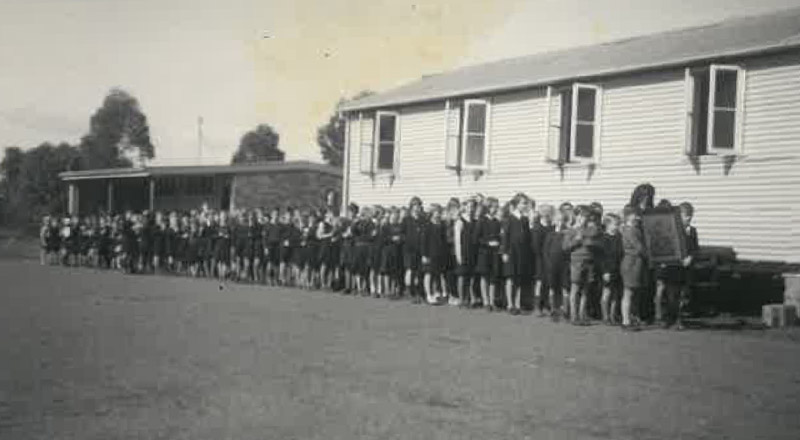 Historical image of students lining up for class at St Michael's Primary School Blacktown South