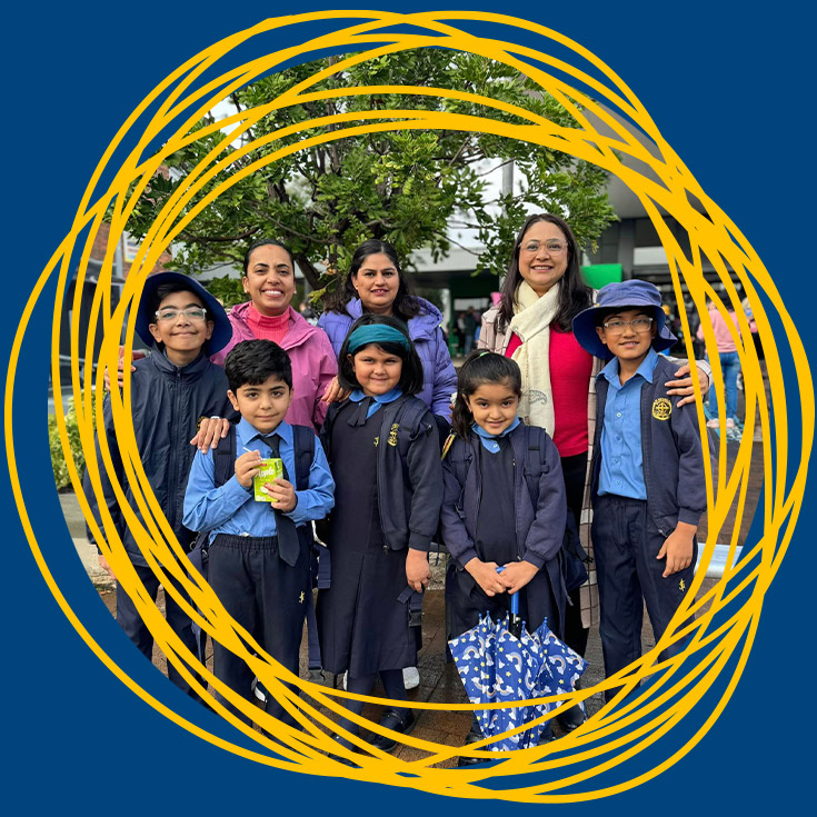 Students with their families in the playground at a school event at St Michael's Primary School Blacktown South