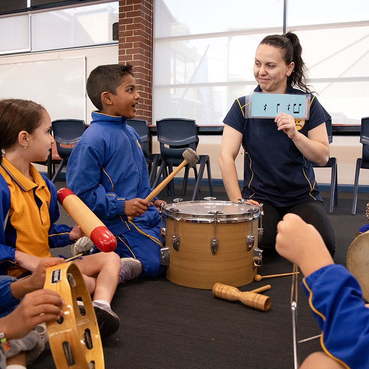 Students and teacher engaging in their music class at St Michael's Primary School Blacktown South