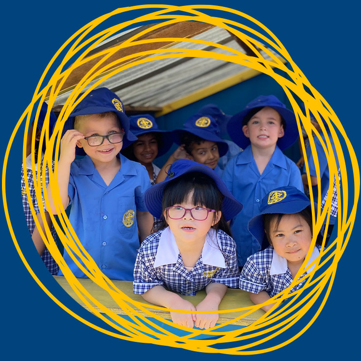 Students playing together in the cubby house at St Michael's Primary School Blacktown South